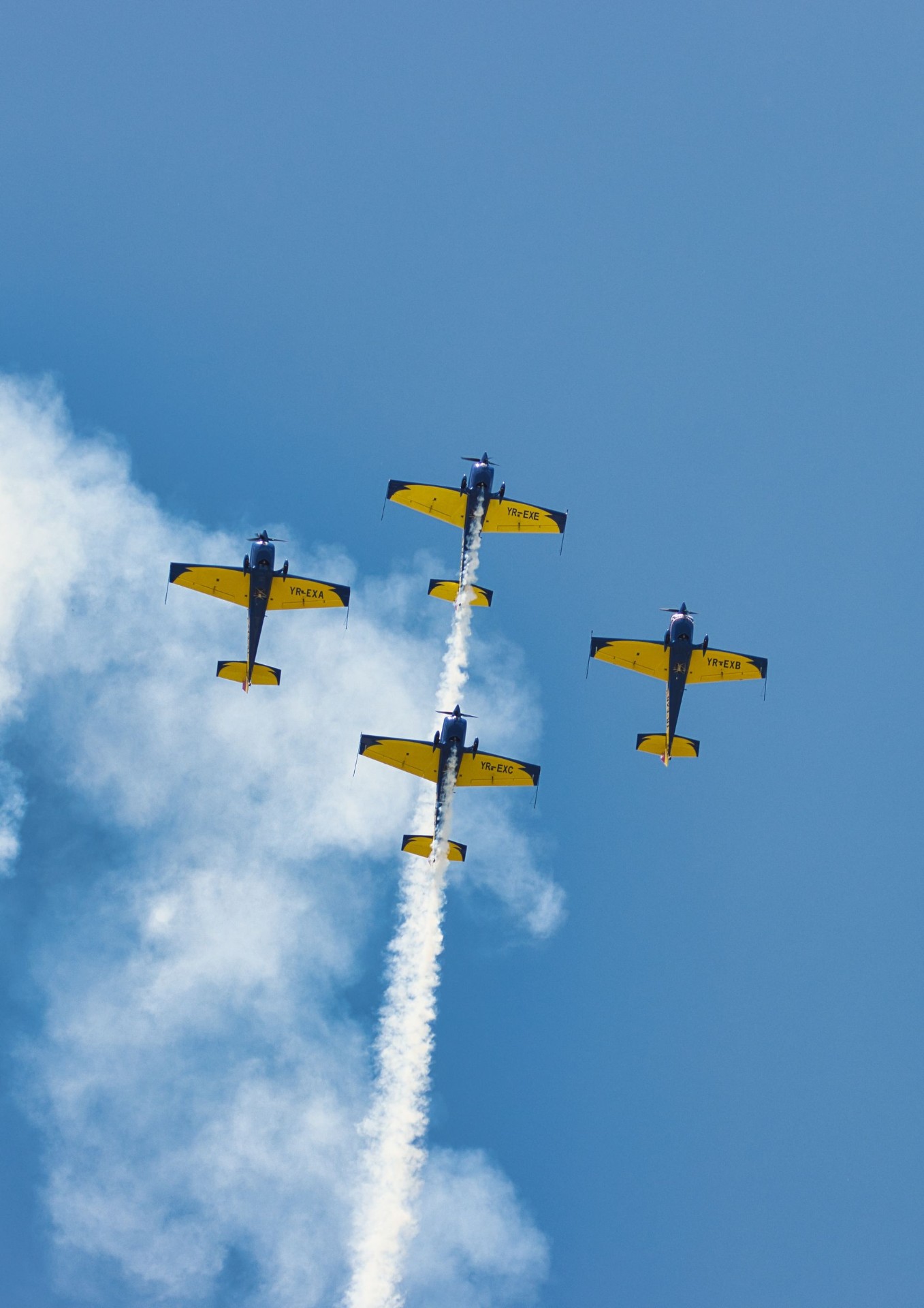 Formation of aerobatic aircraft trailing smoke